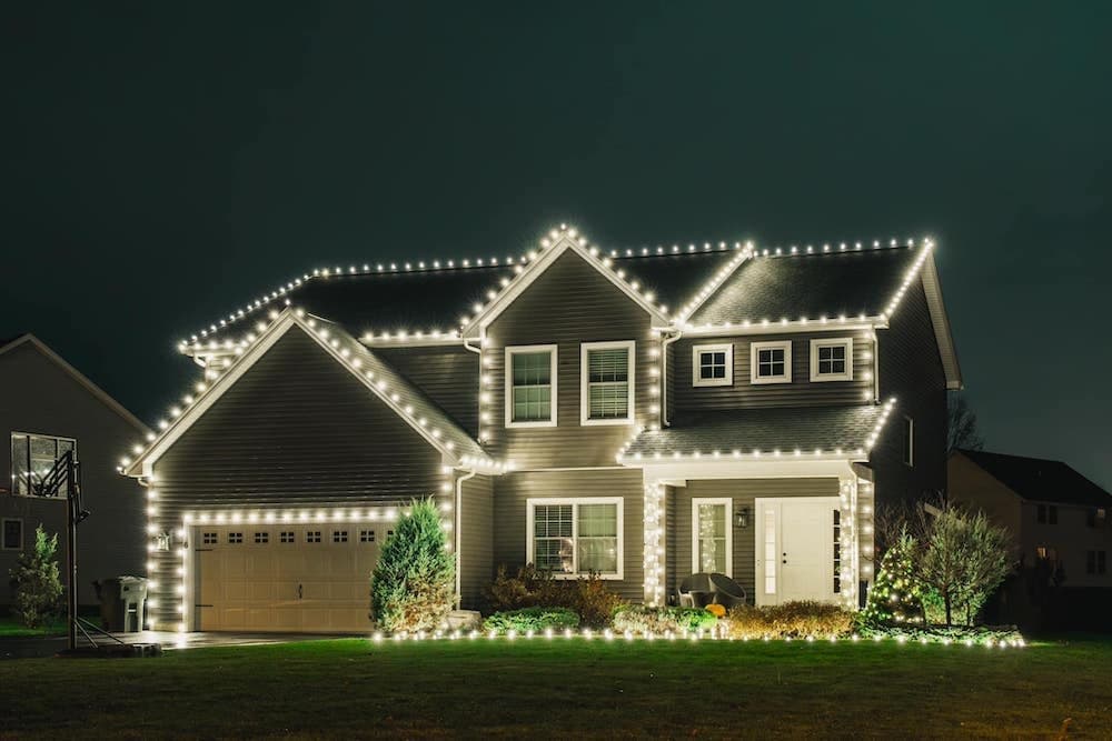 Clean C9 bulb roofline on a modern home